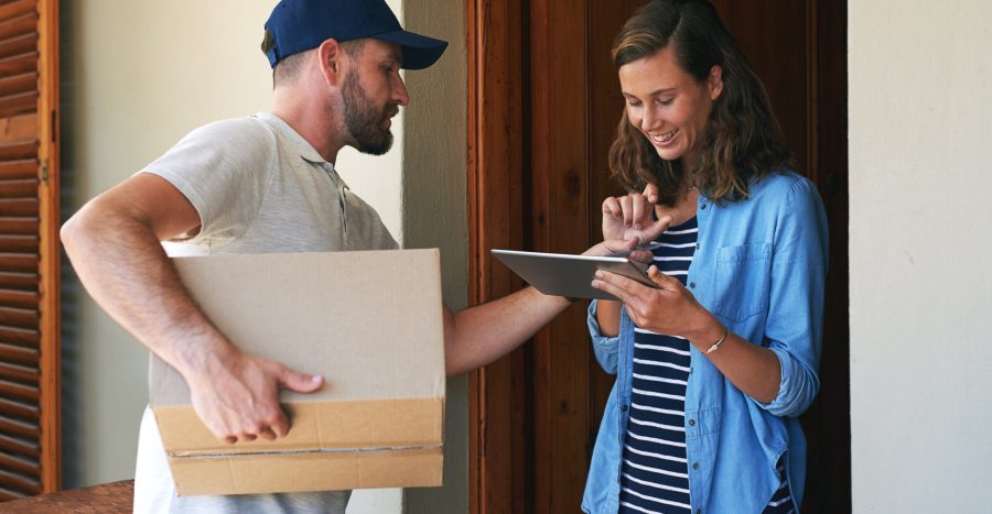 Términos de Servicio Woman, delivery man and box with tablet for ecommerce order, parcel or cargo in transport service. Female person receiving shipment from male courier, supply chain or online purchase at front door.